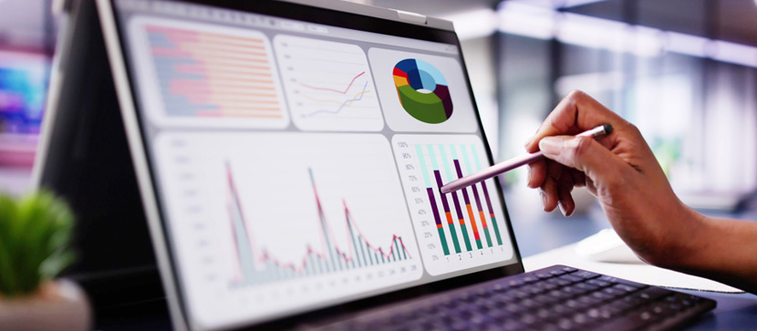 Photo of someone pointing to a line of data on a screen
