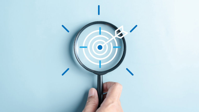 Magnifying glass overlayed with drawn elements that depict a target