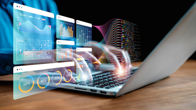 Montage image of someone operating a laptop overlayed with graphical data